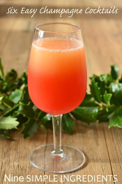 Six Easy Champagne Cocktails from Nine Simple Ingredients, including the Red Mimosa. This is a twist on a regular mimosa with the addition of grenadine for color and a twist of citrus.