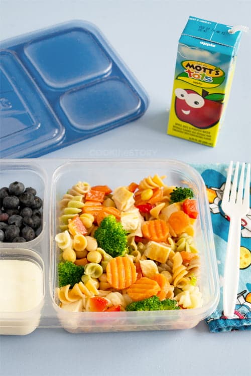 Lunch container with freeze ahead pasta salad with chicken and veggies in the main compartment. 