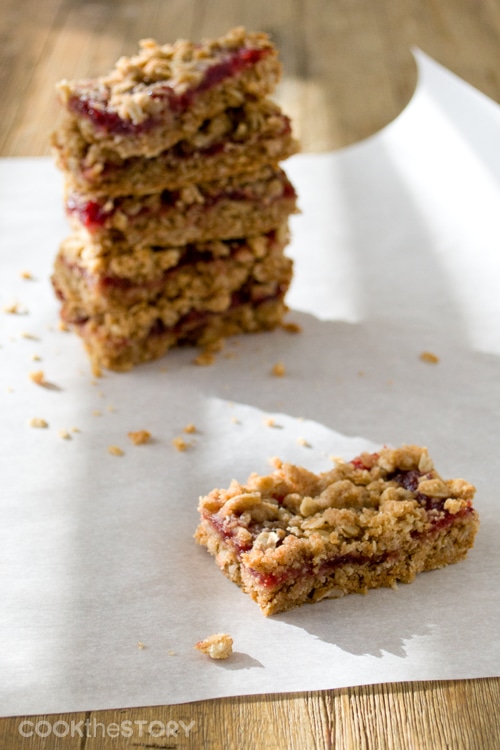 Cranberry Oatmeal Bars, one bar in front of a stack of bars.