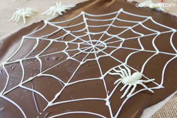 Two-Ingredient Spider's Web Halloween Chocolate Bark - This spooky Halloween treat is as fun to make as it is to eat. Perfect for a kid's classroom party!