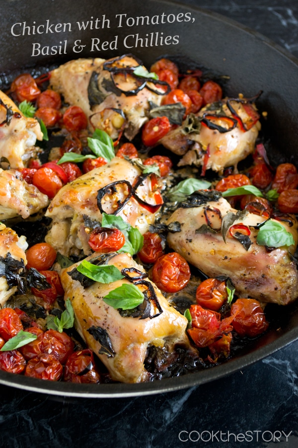 Baked Chicken with Tomatoes and Basil and Chilies in a large pan.