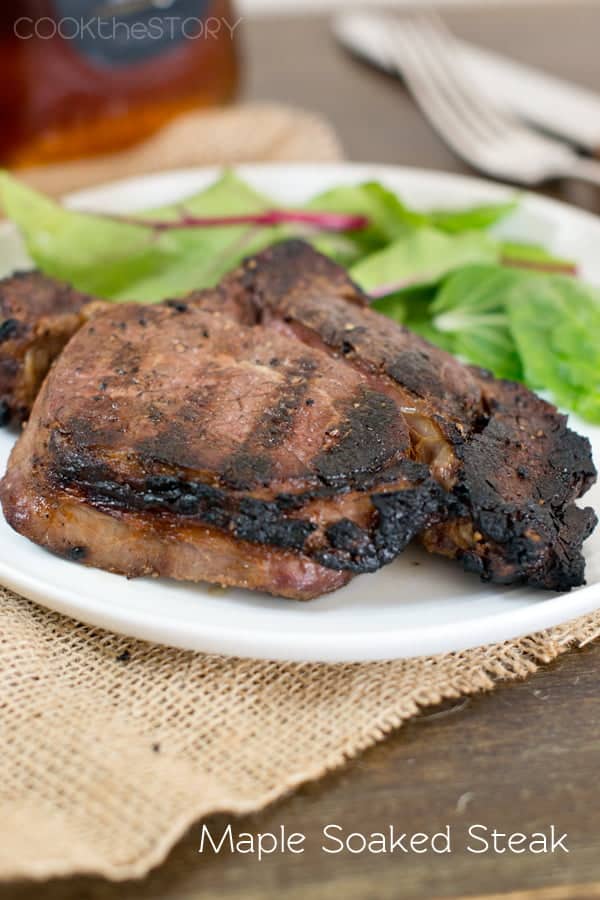 Maple Soaked Steaks on a plate with salad.