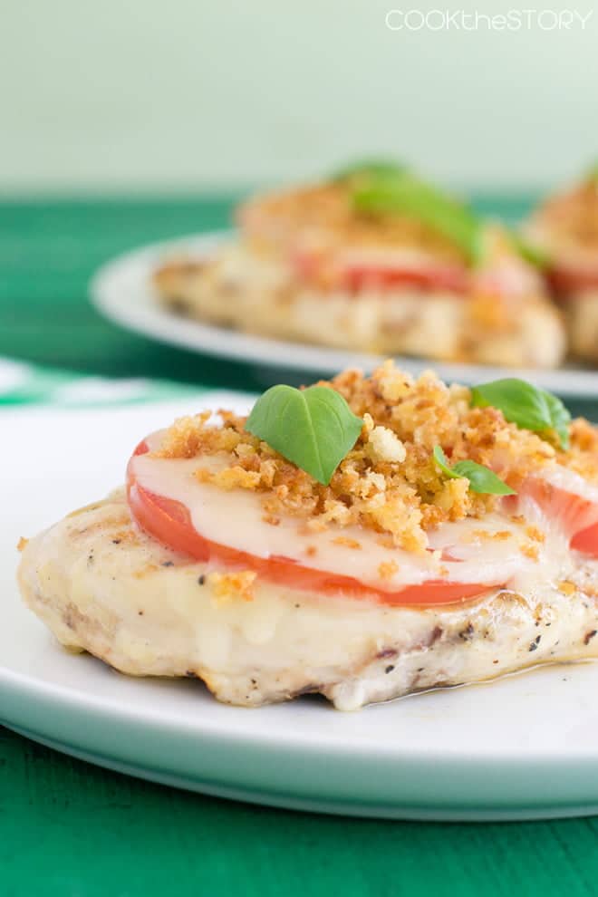 Grilled Chicken breast topped with tomato slices, melted mozzarella, and toasted breadcrumbs.