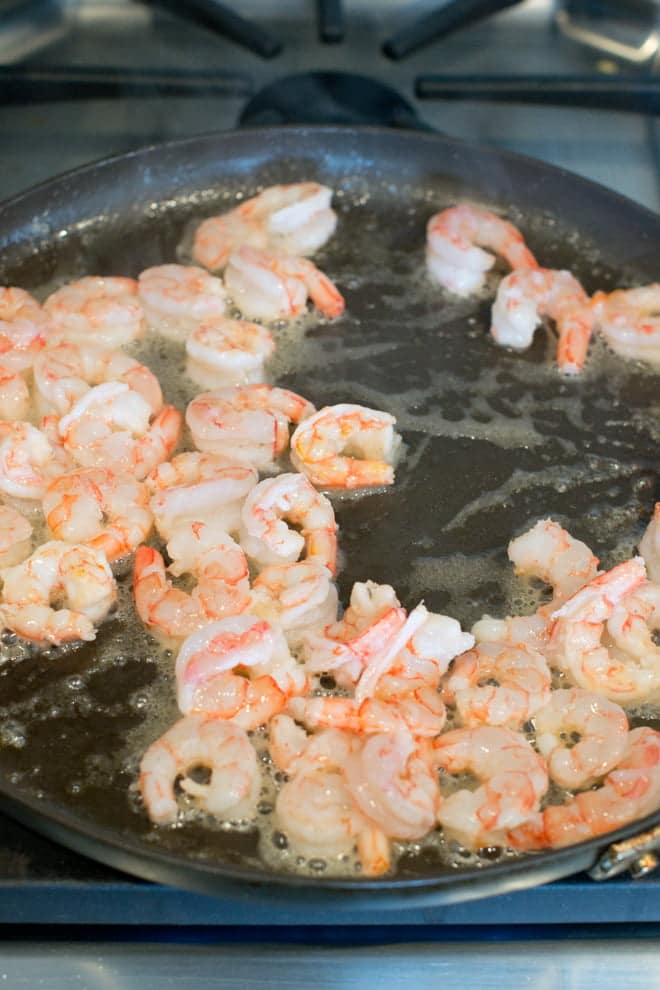 Royal Red Shrimp cooking in a pan with butter.